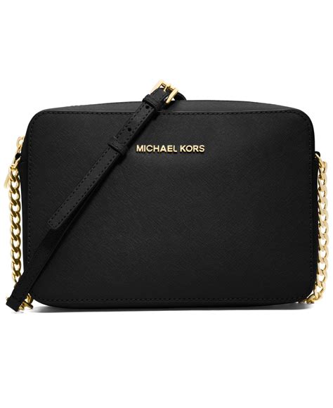 michael kors jet set travel crossgrain black and gold|Michael Kors airplane purse.